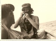 Celina Seghi acquaints hereself with a rebreather at the first diving school in 1948 on the island of Elba